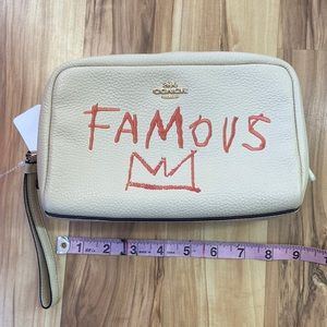 Coach Cream Wristlet with Red Graphic